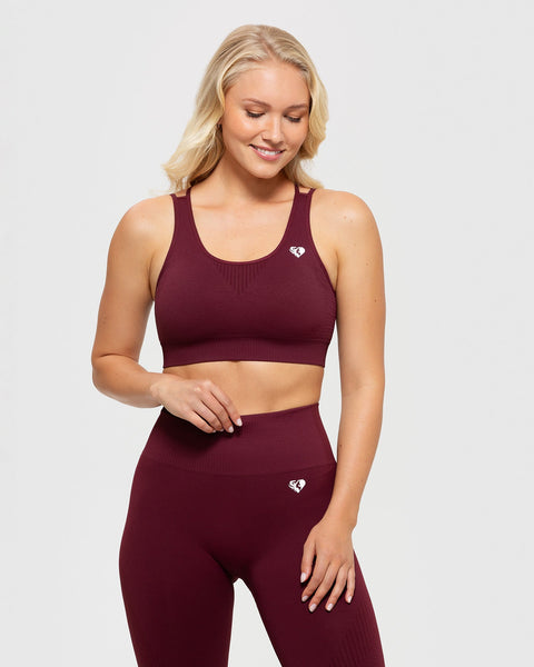 HIIT essential sports bra with taping in cherry